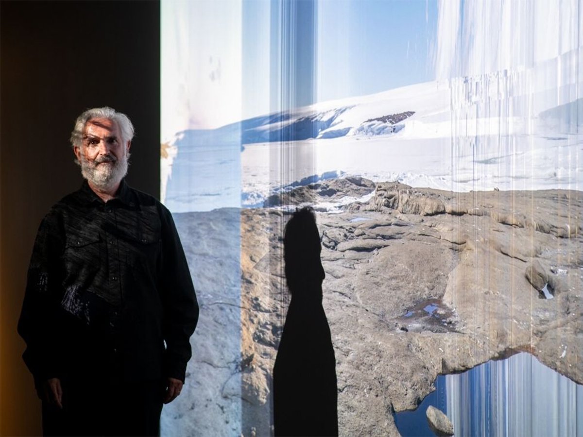 Philip Samartzis in front of Philip Samartzis, Martin Walch and Sean Williams, 'The Magnetic Quiet Zone', 2024, in 'Creative Antarctica: Australian Artists and Writers in the Far South, 2026, Design Hub Gallery